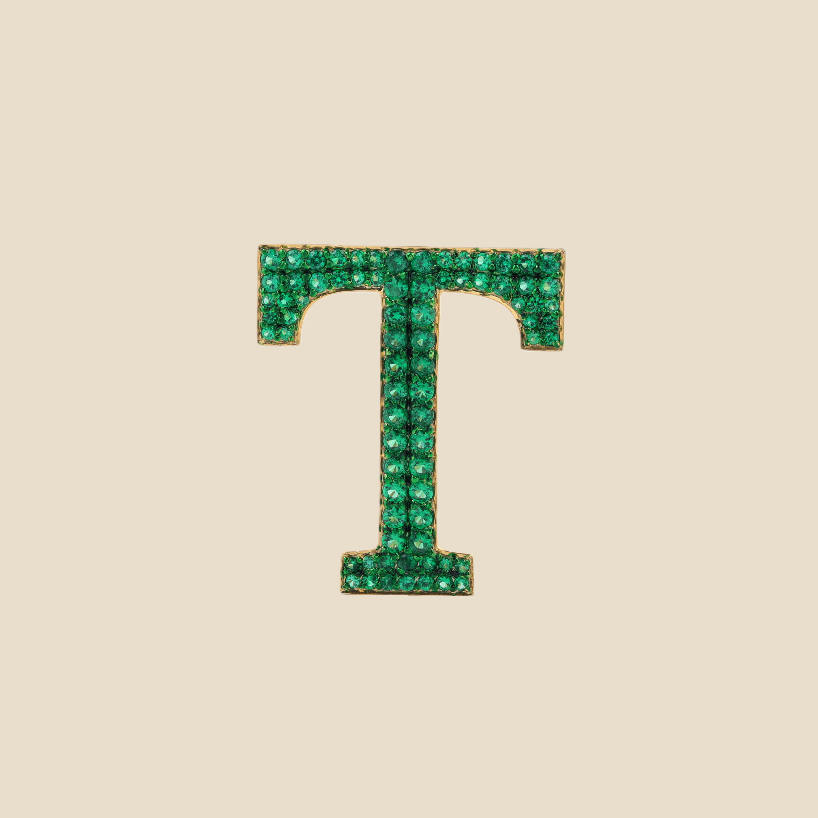 Letter T in Emeralds Tavari