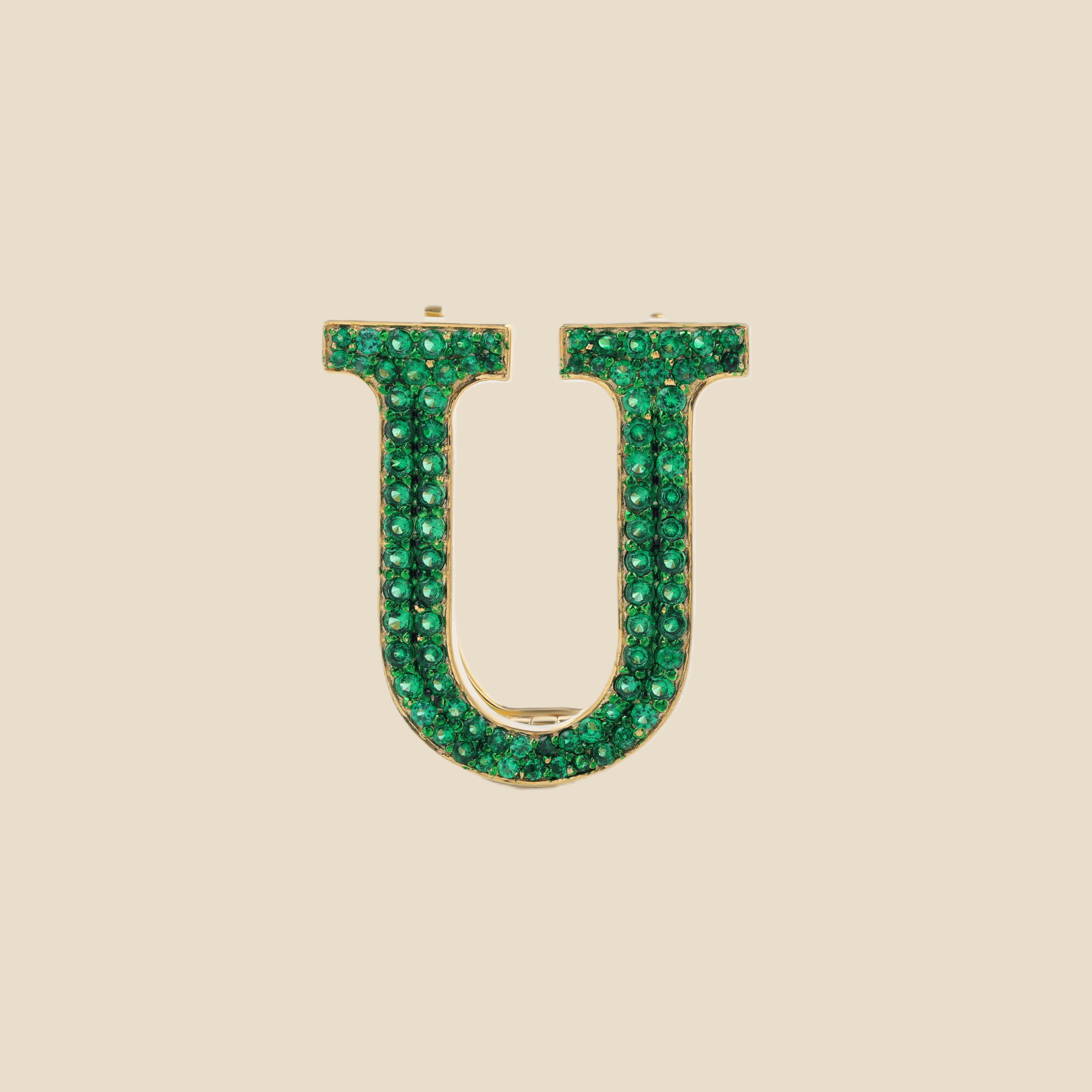 Letter U in Emeralds Tavari
